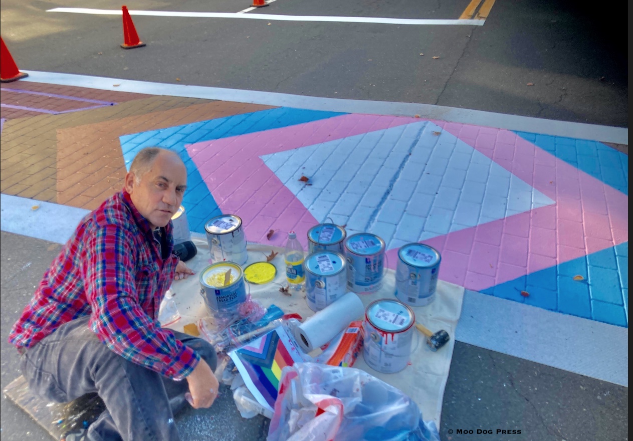 Artist Brian Colbath of West Hartford, literally on the street in Middletown, Connecticut, creating a painted mural. Photo © Moo Dog Press