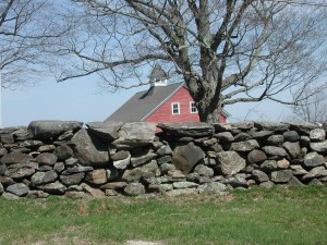 Stones from a field, a sturdy barn and a well-placed tree that provides maple sap for syrup, shade for livestock and color for the joy create a beauty all their own.