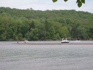 Boat moored near a sandbar in the river where bald eagles are now a more common sight.