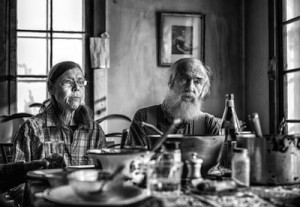 Jack and Anne Lazor — photo by John Nopper - part of a body of work about people who pioneered going back to common sense farming and began in Vermont. Image is linked to Strolling of the Heifers site to learn more.