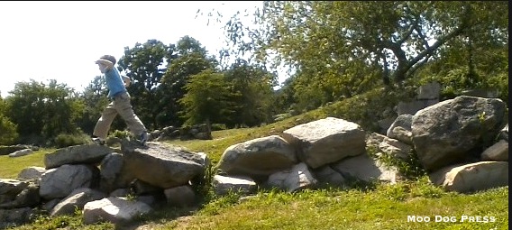 Child on rocks outside.