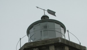 Weathervane arrow atop a lighthouse - another walk.