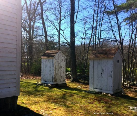 A privy and a matching structure to serve for wood storage to keep the schoolhouse warm. 