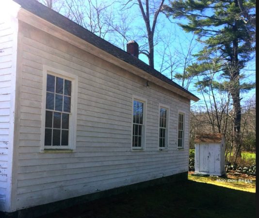 The sunlit side of Wylie Schoolhouse and one outbuilding. CB/MDP