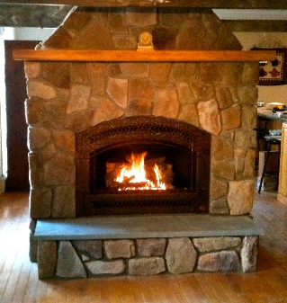 A massive free-standing stone hearth, view one.