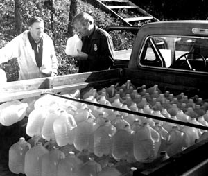 Stacked nearly flush with the truck bed, the half load of liquor pictured here weighed over a 1,000 pounds, even in light plastic jugs. Franklin County, Virginia, 1979, photo courtesy of Ferrum College.