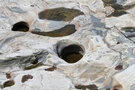 Geological oddities may be found on side trips - such as these potholes grooved and worn by swirling water and stones.