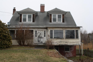 Before. The farmhouse that fronts Greenmanville Avenue, Route 62, in Mystic.
